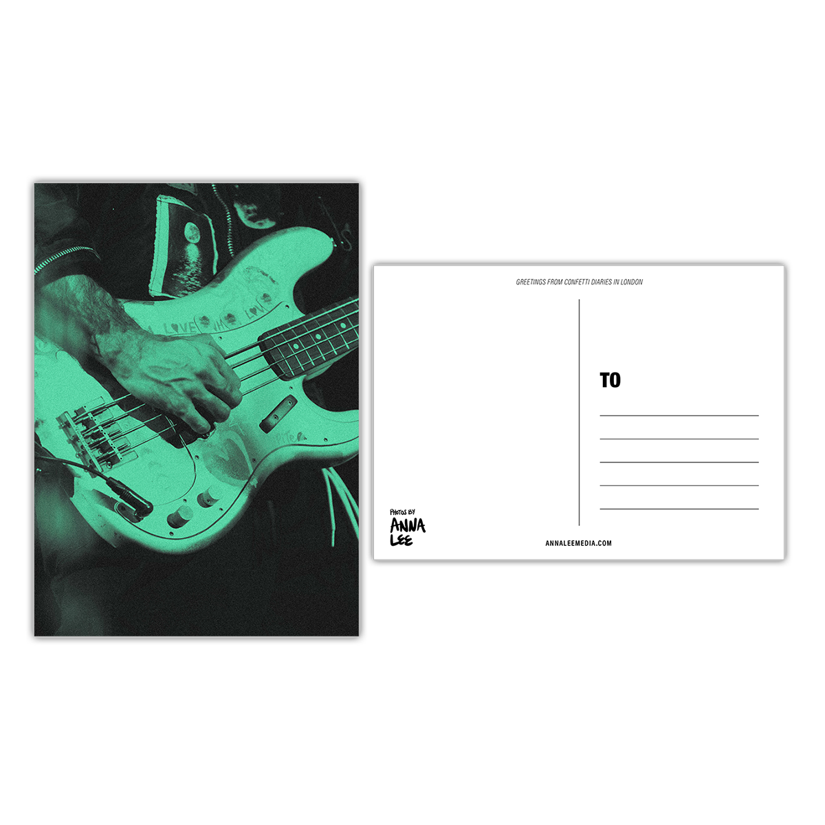 Side-by-side view of a postcard’s front and back. The front shows a close-up portrait of Guy playing bass, his right hand over the strings, and a moon image embroidered on the chest of his jacket. The photo has a green wash. The back, in landscape, features a writing space on the left, address lines on the right, “GREETINGS FROM CONFETTI DIARIES IN LONDON” in sloped text at the top, “Photos by Anna Lee” in the bottom right, and “Annaleemedia.com” centered below.