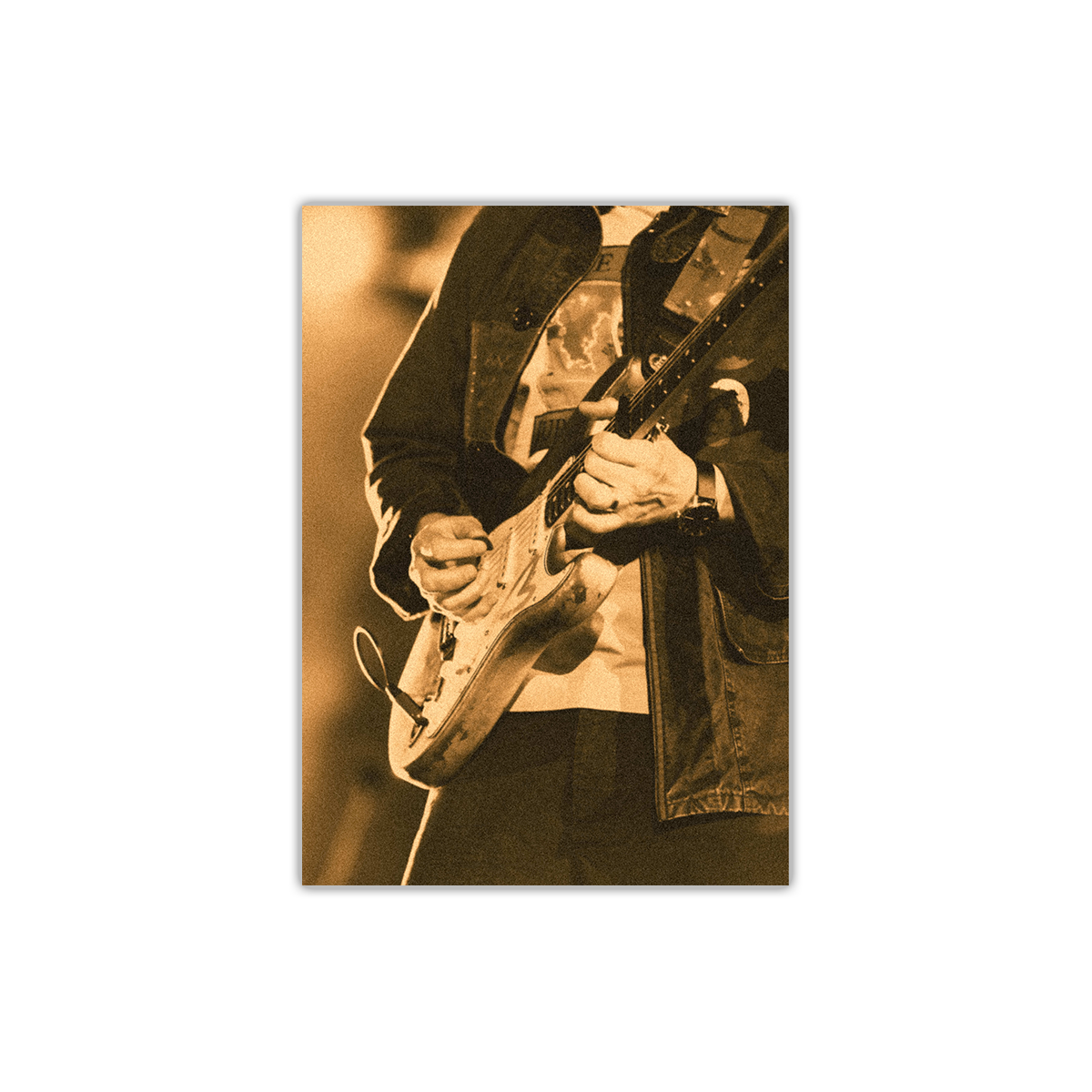The front shows a close-up portrait of Jonny playing electric guitar, a plectrum in his right hand, and a cloud-like image on his shirt. The photo has a vintaged yellow wash.
