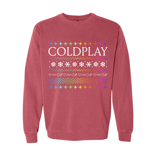 LightRedCrewneckSweatshirt:ColdplayPrintedOnChestInWhite:OnTheTopAreStars, inAllColorsOfThe🌈Blue,Green,Yellow,Orange,Red,Pink&Purple. BeneathColdplayIs aZigzagPatternOfConnected V-shapePeaks,SomeGoUp,SomeGoDown; DotsFormBlue, green, yellow,Orange,Red,Pink&purpleTriangles; aRowOfWhiteSnowflakesIsOn aPatchOfTinyCrossStitches, InMatchingColors;Dotted V shapeTrianglesRepeat, FollowedByWhiteOutlinedHearts,InfinitySigns,Circle&Rainbow. TheDotted V shapesThickenToDoubleSize,Above aFinalRainbowStarsBorder